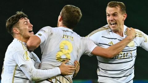 Saarbrucken players celebrate beating Bayern Munich