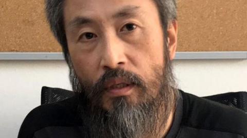 Japanese journalist Jumpei Yasuda heavily bearded in an immigration centre in Turkey