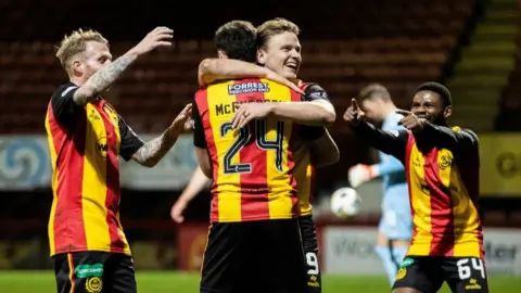 Partick Thistle's Ben McPherson (L) celebrates with Alex Samuel (R) after scoring to make it 3-1 during a William Hill Championship match between Partick Thistle and Ross County at The Wyre Stadium at Firhill, on March 27, 2026, in Glasgow, Scotland