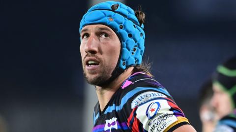 Justin Tipuric looks to the skies