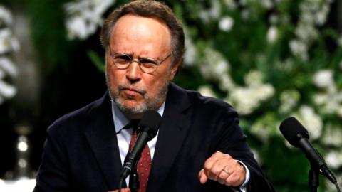 Actor Billy Crystal speaks at a memorial service for the late boxer Muhammad Ali