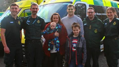 Jayne Rowland and family visiting staff at the Taunton Ambulance Station