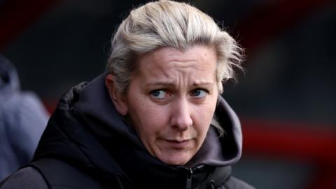 Aston Villa manager Carla Ward watches on