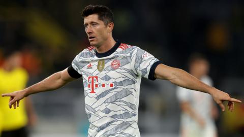 Bayern Munich striker Robert Lewandowski celebrates scoring against Borussia Dortmund in the German Super Cup