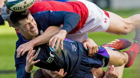 Blair Kinghorn of Scotland drops the ball in a tackle