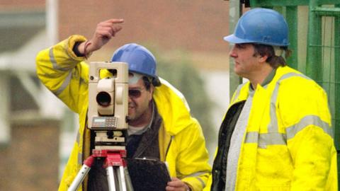 Construction surveyors