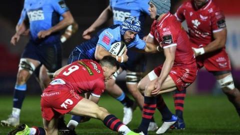 Matthew Morgan takes on Jonathan Davies and Gareth Davies