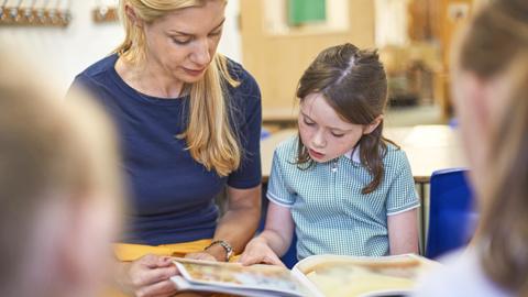 Teacher and pupil at school