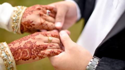 Alisha Rehman and her husband's hands