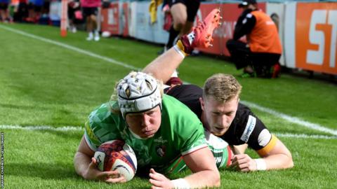 Nic Dolly scores the first of Leicester's eight tries against Ampthill