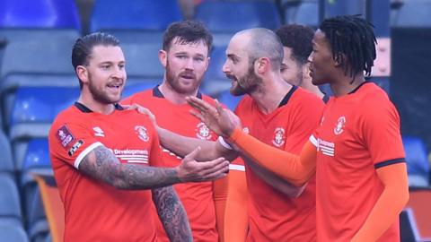 Luton's George Moncur celebrates his goal