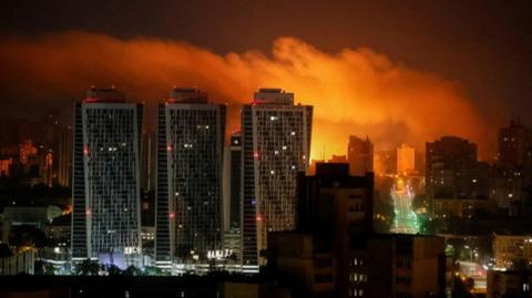drone explosion lights up Kyiv sky