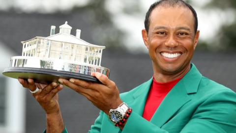 Tiger Woods holding the Masters trophy in 2019