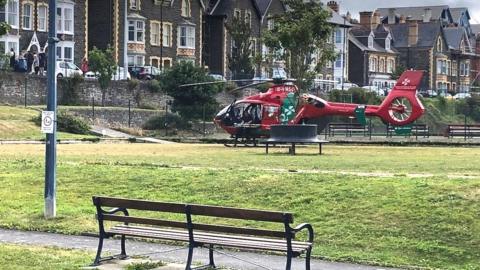 An air ambulance landing in Aberystwyth