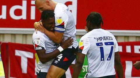 Luton players celebrate Amari'i Bell's goal