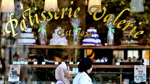 front of Patisserie Valerie shop