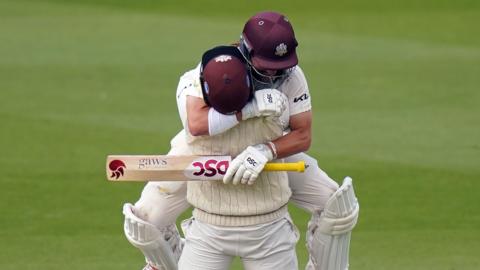 Rory Burns and Ryan Patel celebrate winning the County Championship