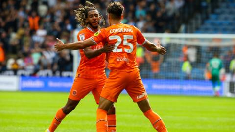 Theo Corbeanu celebrates his goal against Huddersfield