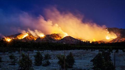 The Thomas Fire burns along a hillside near Santa Paula, California, on 5 December 2017