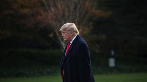 President Donald Trump leaves the Oval Office and walks toward Marine One on the South Lawn of the White House on 14 November