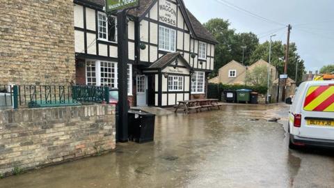 Flood outside pub in Milton