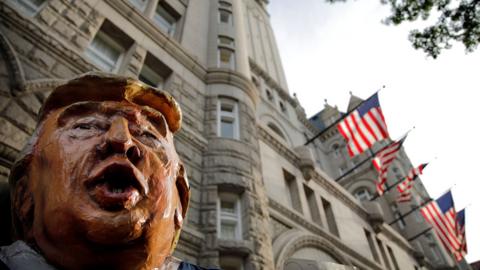 Trump puppet outside hotel