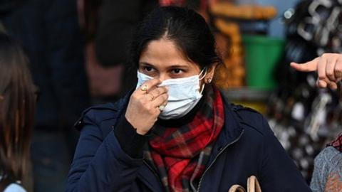 People wear masks as a precautionary measure from COVID at Sarojini Nagar Market in Delhi