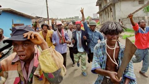 Militiamen of National Patriotic Front of Liberia in the streets.