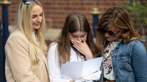 Family opening GCSE results