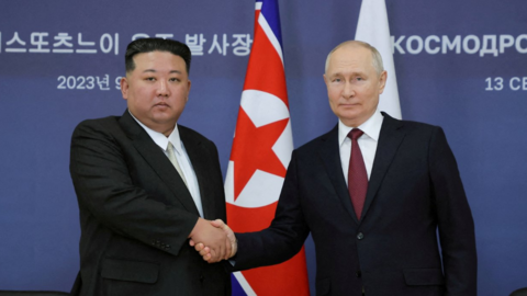 Russia's President Vladimir Putin and North Korea's leader Kim Jong Un shake hands in a meeting in eastern Russia in September 2023