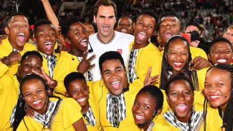 Roger Federer hugs kids after the Match in Africa against Rafael Nadal at Cape Town Stadium on 7 February 2020