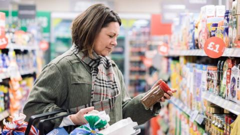 Woman in McColl's store