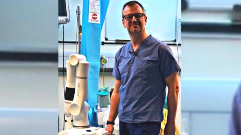 Surgeon with Versius robot