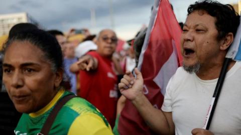 A Bolsonaro supporter confronts a Lula supporter
