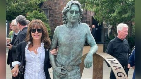 Laura Lian with the John Lennon Peace Statue