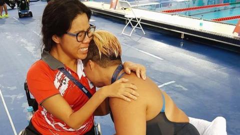 Yip Pin Xiu hugs Theresa Goh