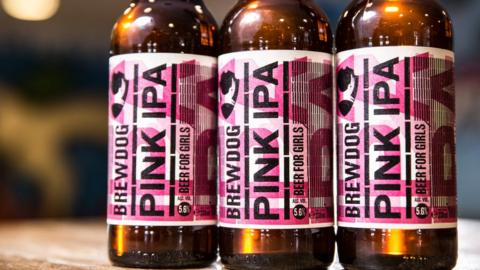 Three bottles of Pink IPA beer