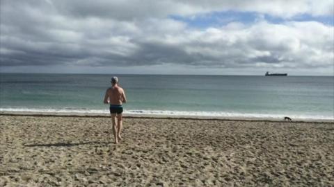 Man on a Cornish beach