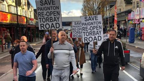 Traders march on Torbay Road