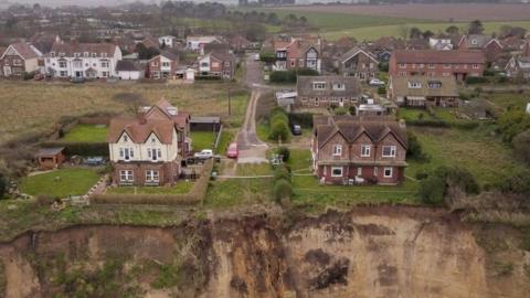Houses near a collapsing cliff at Mundesley in Norfolk