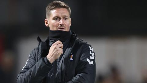 Cambridge United interim boss Barry Corr watches on