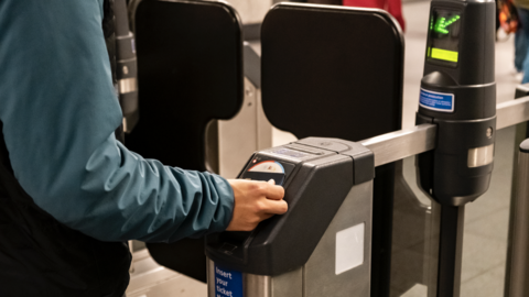 Man touches in at ticket barrier