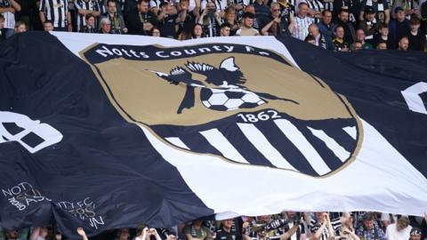 Notts County fans with a giant flag