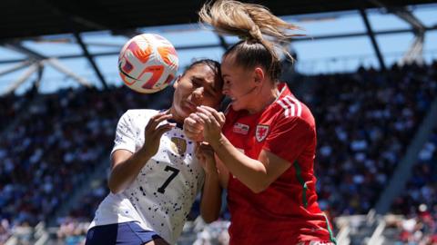USA forward Alyssa Thompson collides with Wales' Lily Woodham
