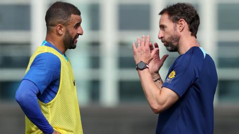 Kyle Walker talking to Gareth Southgate