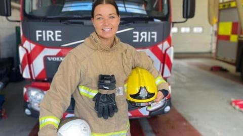 Rachel Unitt in firefighter gear