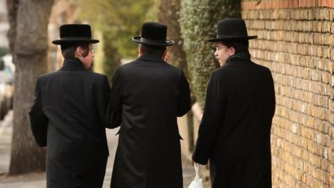 Jewish boys walking down street