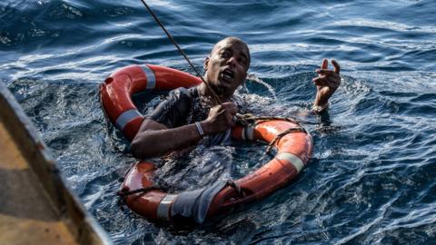 A migrant shown being rescued on January 4, 2019