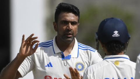 Ravichandran Ashwin celebrates taking a West Indies wicket