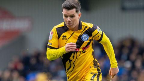 Liam Kelly in action for Rochdale